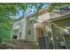 A view of the backyard featuring light colored siding with window and patio at 6540 Arbor Gate Sw Dr # 3, Mableton, GA 30126