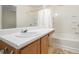 This bathroom includes a vanity with a sink and a bathtub with shower at 6540 Arbor Gate Sw Dr # 3, Mableton, GA 30126