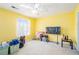 A sunlit bedroom with bright yellow walls and carpeted floors at 6540 Arbor Gate Sw Dr # 3, Mableton, GA 30126