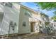 Back exterior view of siding clad townhouse with small patio area at 6540 Arbor Gate Sw Dr # 3, Mableton, GA 30126