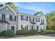 Charming townhouse featuring a well-manicured lawn and classic architectural details at 6540 Arbor Gate Sw Dr # 3, Mableton, GA 30126