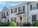 Charming townhouse featuring a well-manicured lawn and classic architectural details at 6540 Arbor Gate Sw Dr # 3, Mableton, GA 30126