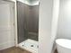 Modern bathroom features a glass-enclosed shower with gray subway tile, a built-in seat, and sleek hardware at 1673 Fuma Leaf Way, Mcdonough, GA 30253