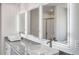 Bright bathroom with double vanity, granite countertops, vessel sinks, and illuminated mirrors at 1673 Fuma Leaf Way, Mcdonough, GA 30253