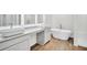 Bright bathroom with double vanity, vessel sinks, granite countertops, and standalone tub at 1673 Fuma Leaf Way, Mcdonough, GA 30253