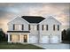 Charming two-story home with a brick facade, black roof, and a well-manicured front lawn and a two car garage at 1673 Fuma Leaf Way, Mcdonough, GA 30253