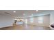 This open-concept area seamlessly connects the spacious living room with the modern kitchen and a cozy electric fireplace at 1673 Fuma Leaf Way, Mcdonough, GA 30253