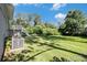 Spacious backyard with a deck, grass, and mature trees, ideal for entertaining at 2641 Clifton Springs Rd, Decatur, GA 30034