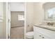 Bathroom with a granite countertop, white cabinets and view to the bedroom at 2641 Clifton Springs Rd, Decatur, GA 30034