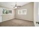 Comfortable bedroom with carpet, ceiling fan, and natural light from dual windows at 2641 Clifton Springs Rd, Decatur, GA 30034
