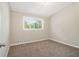 Bedroom featuring wall-to-wall carpet and a view outside at 2641 Clifton Springs Rd, Decatur, GA 30034