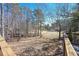 Enjoy this backyard view overlooking the serene greenery and golf course from the wooden deck at 9001 E Carroll Rd, Winston, GA 30187