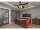 Cozy bedroom with wood-look tile flooring, trey ceilings, and neutral color palette at 9001 E Carroll Rd, Winston, GA 30187