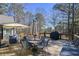 Entertain on this deck, featuring outdoor seating and a grill perfect for gatherings and enjoying the surrounding scenery at 9001 E Carroll Rd, Winston, GA 30187