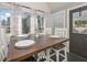 Bright dining area with a rustic table set for four, large windows, and a warm welcome at 9001 E Carroll Rd, Winston, GA 30187