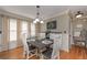 The dining room features a stylish table, decor, and natural light, perfect for Gathering gatherings at 9001 E Carroll Rd, Winston, GA 30187