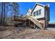 Two-story home with spacious backyard, a large deck perfect for outdoor relaxation, and convenient access to the lower level at 9001 E Carroll Rd, Winston, GA 30187