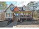 Charming home with a welcoming front porch, wooden pillars and shutters, set in a serene, wooded neighborhood at 9001 E Carroll Rd, Winston, GA 30187