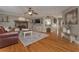 Bright living room boasts hardwood floors, a stone fireplace, and stylish decor, creating a welcoming atmosphere at 9001 E Carroll Rd, Winston, GA 30187
