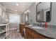 Elegant main bathroom with dual vanities, granite countertops and walk-in closet access at 9001 E Carroll Rd, Winston, GA 30187