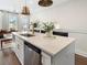 Modern kitchen island with stainless steel appliances, quartz countertops, and sleek design at 921 Hughley Circle Se # 66, Atlanta, GA 30316