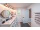 Bright bathroom features double sinks, modern lighting, and stylish fixtures at 110 W Putnam Ferry Rd, Woodstock, GA 30189