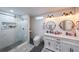 Contemporary bathroom boasts a marble shower, double vanity, and elegant finishes at 110 W Putnam Ferry Rd, Woodstock, GA 30189