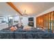 Open concept living room featuring a fireplace and view into the modern kitchen at 110 W Putnam Ferry Rd, Woodstock, GA 30189