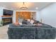 Cozy living room with a large sectional sofa, fireplace, and stylish decor at 110 W Putnam Ferry Rd, Woodstock, GA 30189