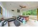 Inviting covered patio with comfortable seating and a relaxing hot tub for ultimate outdoor enjoyment at 110 W Putnam Ferry Rd, Woodstock, GA 30189
