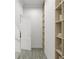 Bright hallway featuring hardwood floors and a built-in bookshelf, perfect for displaying decor at 1161 Dahlonega Hwy # 9, Cumming, GA 30040