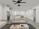 Open concept living room features recessed lighting, ceiling fan, and easy access to the kitchen area at 1161 Dahlonega Hwy # 9, Cumming, GA 30040