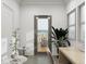 Bright office space with natural light from windows and door to balcony, accented by plants and decor at 1161 Dahlonega Hwy # 9, Cumming, GA 30040