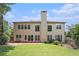 Exterior of home showcasing a spacious backyard with well-manicured lawn and mature landscaping at 3505 Belridge Ln, Smyrna, GA 30080