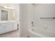 Well-lit bathroom featuring a shower and a white vanity with a spacious countertop at 3505 Belridge Ln, Smyrna, GA 30080