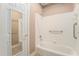 Clean bathroom featuring a white tiled tub and shower combo at 3505 Belridge Ln, Smyrna, GA 30080