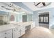 Primary bathroom boasts double sinks, a large mirror, and access to the soaking tub at 3505 Belridge Ln, Smyrna, GA 30080