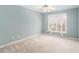 Light-filled bedroom with a ceiling fan and a large window with sheer curtains at 3505 Belridge Ln, Smyrna, GA 30080