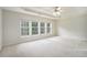 Spacious bedroom with tray ceiling, ceiling fan, and natural light from large windows at 3505 Belridge Ln, Smyrna, GA 30080