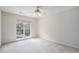 Bright bedroom features large window and neutral carpet flooring at 3505 Belridge Ln, Smyrna, GA 30080