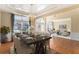 Open dining and living space with elegant dining set, hardwood floors, and a view of the living room at 3505 Belridge Ln, Smyrna, GA 30080