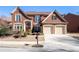 Charming two-story brick home with a two-car garage and landscaped front yard on a sunny day at 3505 Belridge Ln, Smyrna, GA 30080