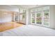 Bright living room flows into dining area and features large windows offering backyard views at 3505 Belridge Ln, Smyrna, GA 30080