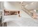 Open-concept living room showcases a fireplace, staircase, and kitchen view at 3505 Belridge Ln, Smyrna, GA 30080