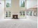 Bright living room features soaring ceilings, many windows, and a cozy fireplace at 3505 Belridge Ln, Smyrna, GA 30080