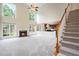 Spacious living room with a cozy fireplace and staircase leading to the second floor at 3505 Belridge Ln, Smyrna, GA 30080