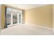 Bright, neutral room with large windows and soft carpet flooring at 3505 Belridge Ln, Smyrna, GA 30080