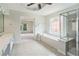 Luxurious main bathroom with a glass shower, soaking tub, and a view to the main bedroom at 3505 Belridge Ln, Smyrna, GA 30080
