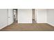 Carpeted room with views to an open doorway and an adjacent kitchen with white cabinets at 3658 Madison St, College Park, GA 30337