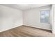 Bedroom with neutral carpeting, a window for natural light, and neutral paint at 3658 Madison St, College Park, GA 30337
